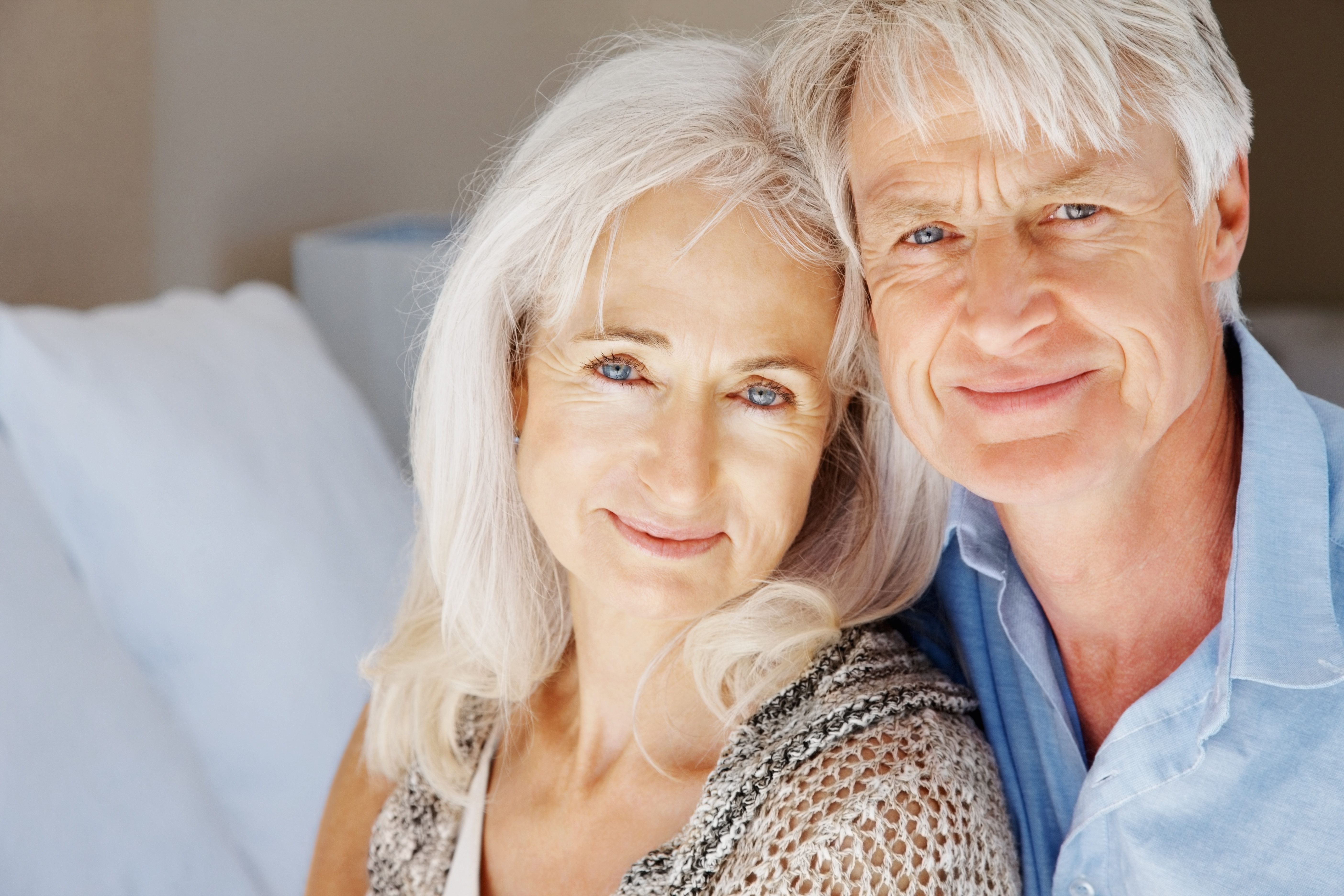 older man and woman smiling