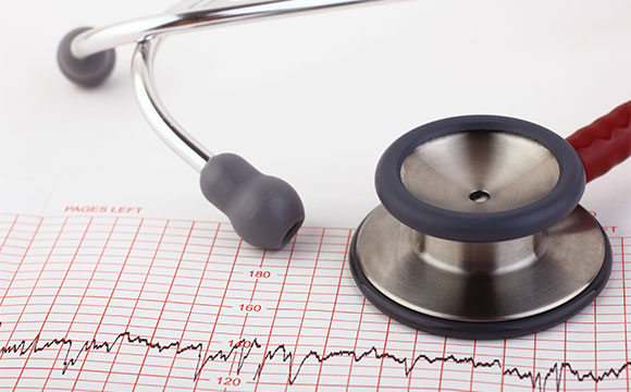 stethoscope and EKG graph