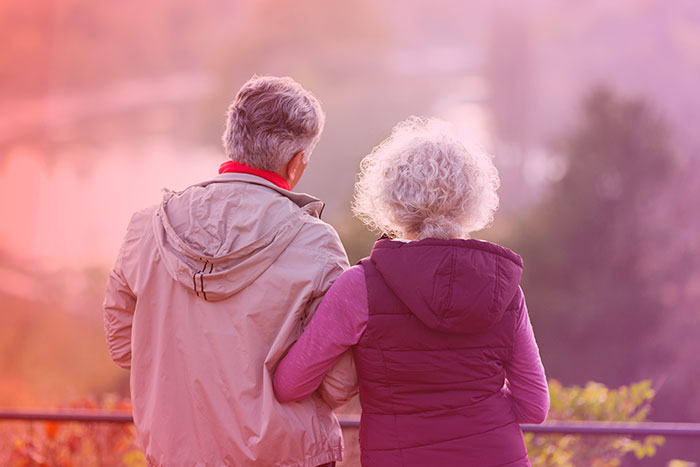 Happy elder couple on nature hike