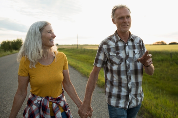Older couple walking outside